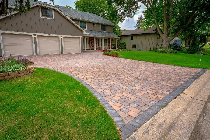 alt="Paver driveway installation near me, interlocking pavers, Minneapolis paver contractors, brick driveway design, custom paver driveway services